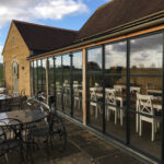 Outdoor seating at the Cotswold Food Store
