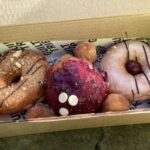 Granola, blueberry and white chocolate cheesecake and vanilla glaze dougnuts at Guilt Trip Donuts