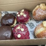 Boston cream, blueberry and white chocolate cheesecake and salted caramel and fudge doughnuts at Guilt Trip Donuts