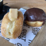 Boston cream and salted caramel and fudge doughnuts at Guilt Trip Donuts