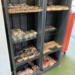 Doughnut and tray bake selection at St George's Bakery, Corse