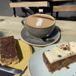 Cappuccino, millionaire shortbread and carrot cake slice at the Retreat cafe in Grassington, Yorkshire