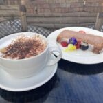 Raspberry and white chocolate cake and cappuccino at the Village Bistro in Chaddesley Corbett
