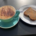 Chocolate and banana cake with cappuccino at Cup Coffee Shop in Hagley