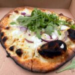 Goats cheese and onion wood-fired pizza from Manon's Riverside Cafe at the National White Water Centre in Bala