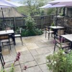 Outdoor seating area at The Old Bakery in Winchcombe, Gloucestershire