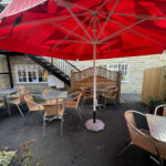 Outdoor courtyard seating at the Village Cafe in Bidford-on-Avon