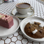 Raspberry patisserie, cookie and cappuccino at Stacc Bakes in Ilfracombe, Devon