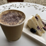 Lemon & blueberry cake and cappuccino  at The Baking Bird coffee van at Coombe Hill Farmshop