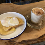Poached eggs and cappuccino at the Ring Feeder Cafe in Devon