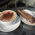 Cappuccino & caramel eclair from Erika Cake & Coffee shop in Hereford