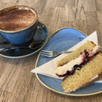 Victoria sponge and cappuccino at Cotswold Farm Park cafe