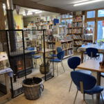 Indoor seating and wood 
burner at Aardvark Books cafe in Bucknell 