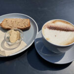 Chocolate banana loaf and a cappuccino at Nom Coffee Shop