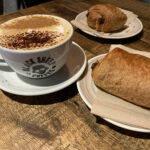 Cappuccino & pain au chocolat at Black Sheep Coffee House in Deansgate, Greater Manchester