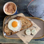 Poached egg on Peter Cooks Bread sourdough & cappuccino at No3a Social in Bromsgrove