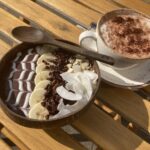 Cocoa acai bowl & cappuccino at Rain Bowls cafe in Cheltenham