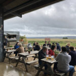 Outdoor seating at the Diddly Squat farm shop 'big view' cafe