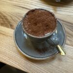 Cinnamon cappuccino at the Faun cafe in the Morgan Experience Centre